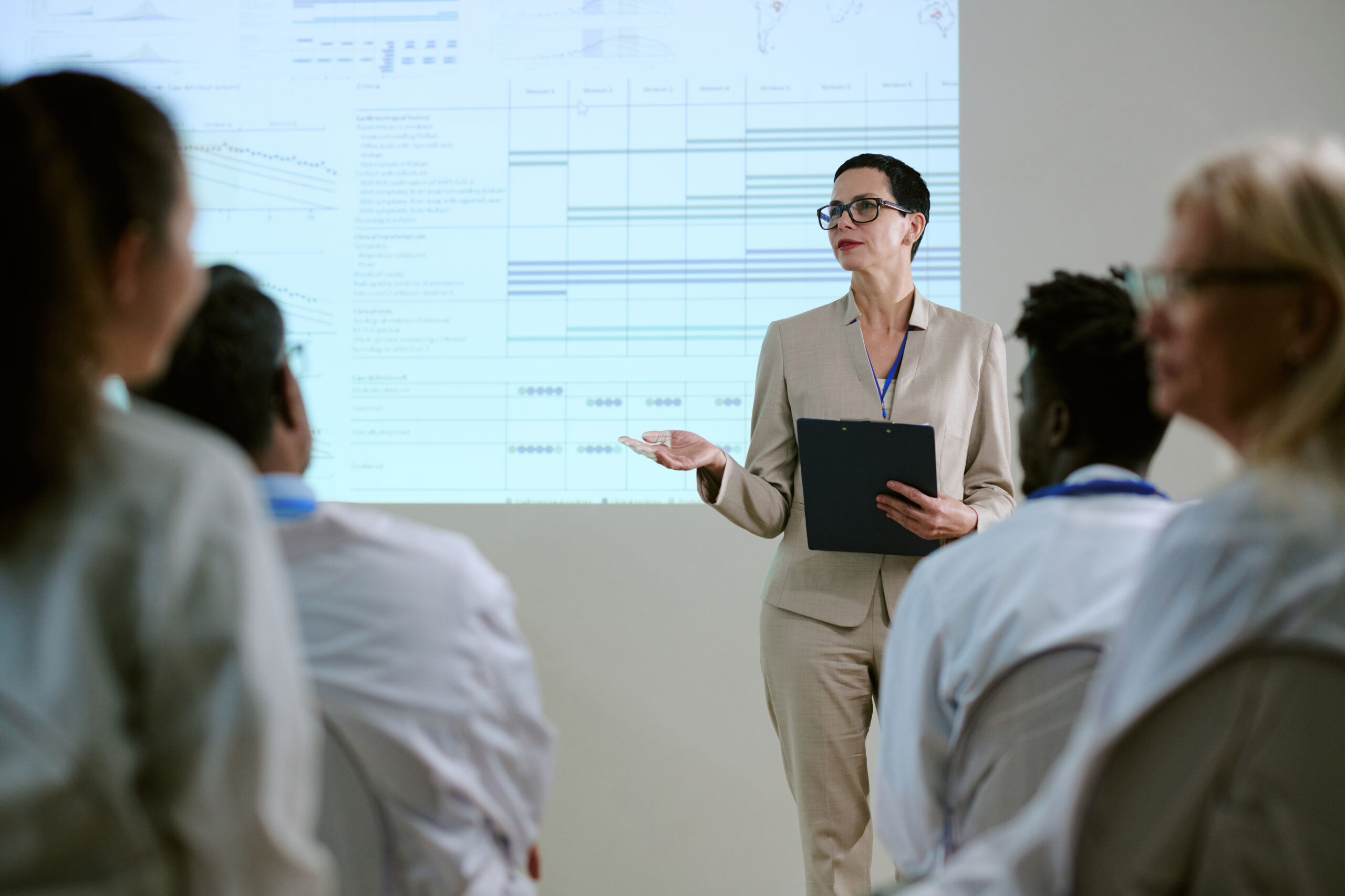 middle-aged-woman-leading-presentation-to-diverse-2026-01-11-11-13-03-utc-scaled